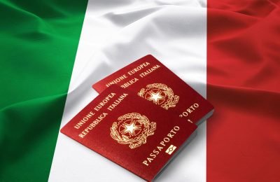 italy-passport-on-the-top-of-an-satin-italian-flag